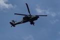 Boeing AH-64 attack helicopter on formation during an air show. Greek Air Force Apache flying on Thessaloniki, Greece during the