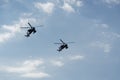 Boeing AH-64 attack helicopters on formation during an air show. Greek Air Force Apache flying on Thessaloniki, Greece during the