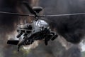 Boeing AH-64D Apache Longbow through the smoke.