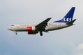 Boeing 737-683 LN-RCW airline Scandinavian Air System in a cloudy sky. Side view Royalty Free Stock Photo