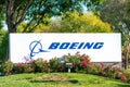 Boeing logo, sign on signpost at company office. The Boeing Company is an American multinational aerospace corporation. -