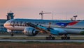 Boeing 777-300 Qatar Airlines on sunset