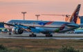 Boeing 777-300 Qatar Airlines on sunset