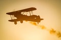 Boeing Stearman biplane flying during sunset Royalty Free Stock Photo