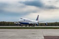 Boeing 747-400 Transaero Airlines is taxing the runway at the airport