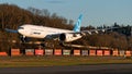 Boeing 777-9X test airplane N779XY landing in golden sunset