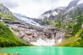 Boeyabreen Glacier in the mountains with lake in the foreground, Jostedalsbreen National Park, Fjaerland, Norway