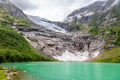 Boeyabreen Glacier in the mountains with lake in the foreground, Jostedalsbreen National Park, Fjaerland, Norway Royalty Free Stock Photo