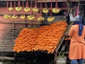 Fresh and sweet carrots are arranged on a wooden carrot