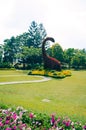 Bogor, Indonesia - A view of the flower themed park Taman Bunga Nusantara in a cloudy afternoon with a view to a bush shaped as a