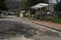 Bus stop destroy and burn pavement with a lot of rocks is the result of disturbs between protesters and colombian police riot