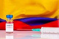 Moderna covid vaccine vial and Colombian flag. Vaccination concept Royalty Free Stock Photo