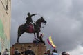 A group of students climb at Simon Bolivar statue waving colombian flags during paro nacional marches