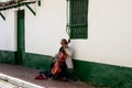 Bogota, Colombia - July 2nd 2023. Senior male musician performing on the streets of La Candelaria at the city center of Bogota