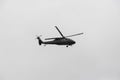 Police black hawk helicopter flying over crow during colombian independence military parade day