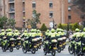 Transit and traffic police officers riding motorcycle make military salute to a crowd Royalty Free Stock Photo