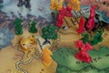 Close up to a Lord of the Rings Risk strategy board game map with color pawns and ring of power over Lorien country