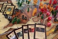 Close up to a Lord of the rings risk strategy board game trilogy edition with cards and pawns over a middle earth map with dice