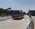 Transmilenio bus near to 161th avenue station on sunny day