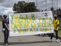 Two young male protesters holding a banner during colombian paro nacional marches