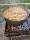 Bograch. Soup with paprika, meat, bean, vegetable, dumpling. Traditional Hungarian Goulash in cauldron. Meal cooked Royalty Free Stock Photo