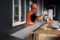 Installers work on installing window blocks at the construction site of a medical aid and rescue center