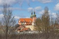 Bohemia church illuminated by sun. Late afternoon in the park.