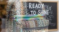 Bohemian backpack with Ready to Shine text in a bright, modern setting Royalty Free Stock Photo