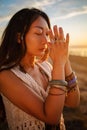 Bohemian chic gypsy happy free asian woman with manicure wearing hands jewelry accessories and white dress. Royalty Free Stock Photo