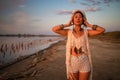 Bohemian chic gypsy happy free asian woman with manicure wearing hands jewelry accessories and white dress. Royalty Free Stock Photo