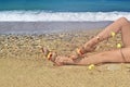 Bohemian greek sandals advertisement on the beach