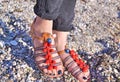 Bohemian sandals advertisement on the beach - greek leather sandals Royalty Free Stock Photo