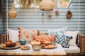 bohemian spread with patterned cushions, hanging macram, and terracotta dinnerware