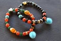 Bohemian style beaded bracelets on a black surface. Royalty Free Stock Photo