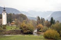 Bohinj church, river and mountains landscape