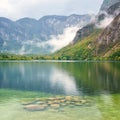 Bohinj lake, Triglav national park, autumn landscape, Slovenia. Scenic view of the water, mountains and forest, travel background Royalty Free Stock Photo