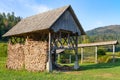 Bohinj, Slovenia - August 19, 2018: Some typical Slovenian hayracks called kozolec, in the Bohinj Valley in summer