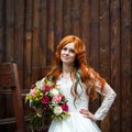 Boho bride with red hair posing