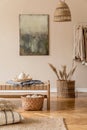 Earth tones living room interior with wooden furnitures and rattan natural decorations.