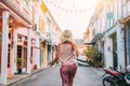 Boho girl walking on the city street