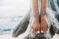 Boho girl wearing indian silver jewelry on the beach