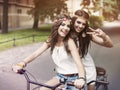 Boho girls riding on bike