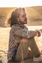 Boho hippie man meditating on the sandy desert Royalty Free Stock Photo