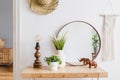 Boho interior design of home office with large mirror.