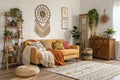 Boho living room with bright wall Royalty Free Stock Photo