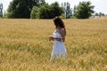 Boho style clothing. sensual woman hold spikelet torn in wheat field. female beauty and summer fashion. Autumn girl enjoy nature. Royalty Free Stock Photo