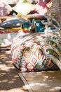 Boho style colorful poufs in garden outdoor decor