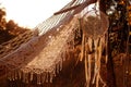 Boho style, hammock in spikelet background at sunset. Lightness and simplicity. Royalty Free Stock Photo