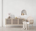 Boho style living room with wicker chair and drawer on white wall background.