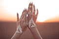 Boho style white hand tattoo. Bohemian woman carefree at the sunset, outddoor photo